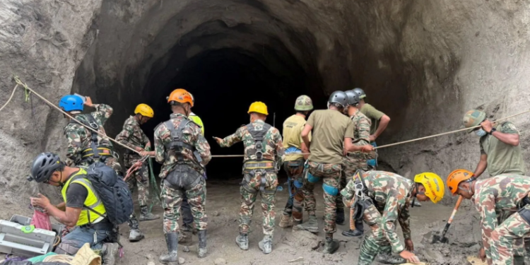 Army personnel have resorted to using explosives to blast into the hillside to reach the trapped workers
