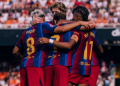 Barcelona players celebrate a goal