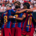 Barcelona players celebrate a goal