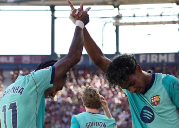 Barcelona's Lamine Yamal celebrates with Raphinha after scoring his side's second goal in the La Liga match against Levante