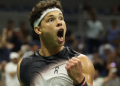 Ben Shelton celebratres winning a point in the US Open quarterfinal against Carlos Alcaraz
