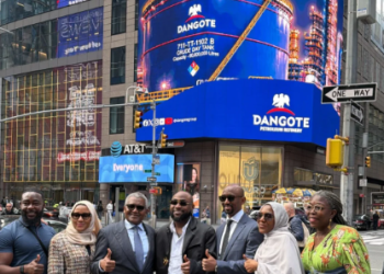 Davido and Aliko Dangote appear beneath a Nasdaq digital billboard in New York’s Times Square as the Dangote refinery’s N2.15tn public offer gains international visibility.