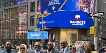 Davido and Aliko Dangote appear beneath a Nasdaq digital billboard in New York’s Times Square as the Dangote refinery’s N2.15tn public offer gains international visibility.