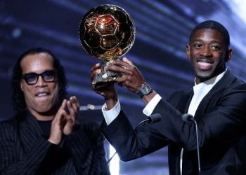 Ousmane Dembélé poses with the 2025 Ballon d’Or after winning the prestigious individual award, as the Paris Saint-Germain forward earns a place on the 30-man shortlist alongside eight other PSG stars for the 2026 prize.