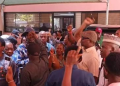 Workers of the Federal Ministry of Education block the ministry’s entrance in Abuja during a protest over the King’s College concession preventing the minister from entering office