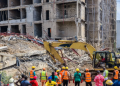 Emergency responders inspect the rubble of a partially collapsed four-storey building under construction at Independence Layout in Enugu State.