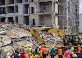 Emergency responders inspect the rubble of a partially collapsed four-storey building under construction at Independence Layout in Enugu State.
