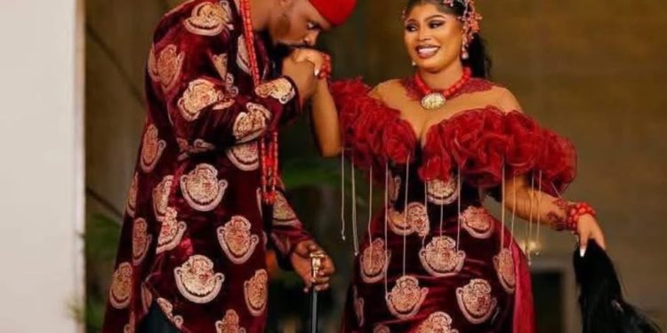 Evan Okoro and her husband, Erikife Fabian Chibuzor, during their traditional marriage ceremony.