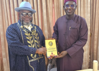 Former Chief of Army Staff, retired Lt.-Gen. Tukur Buratai, receives a plaque from officials of the Defence Correspondents Association of Nigeria (DECAN) during their courtesy visit in Abuja