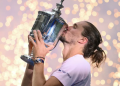 Germany's Alexander Zverev kisses the trophy after defeating the USA's Ben Shelton in the US Open men's singles final in New York on September 13, 2026