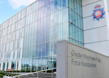 Greater Manchester Police dismiss six serving officers following an internal investigation into racial discrimination against a female officer of African heritage.