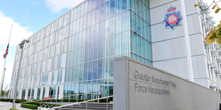 Greater Manchester Police dismiss six serving officers following an internal investigation into racial discrimination against a female officer of African heritage.