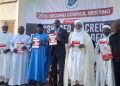 Sultan and others unveil the Interfaith Anti-Corruption Manuals designed to mobilize religious leaders in the fight against corruption.