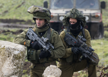 Israeli military troops operate near the Gaza border as the country’s prolonged regional conflicts drive rising defence spending and fuel a dispute over military funding.