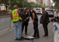 Police investigate a manhole near a Manhattan hotel after two men are arrested for allegedly entering New York City’s underground sewer system in search of valuables during the United Nations General Assembly.