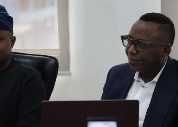 Olumide Fusika with Sowore during the press briefing