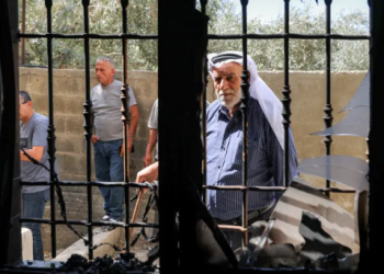 Palestinians inspect a mosque that was attacked by Israeli settlers in the Palestinian village of Bazariya, in the occupied West Bank