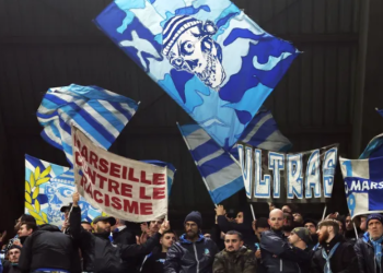 Protesters gather in Leuven during a demonstration over the planned Europa League