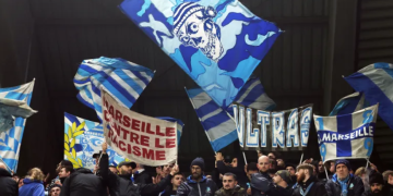 Protesters gather in Leuven during a demonstration over the planned Europa League