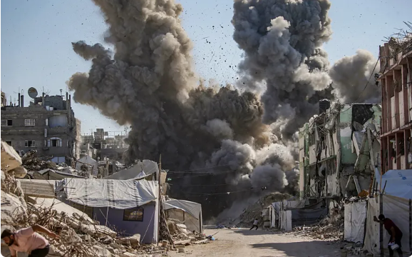 Smoke rises following an Israeli airstrike in the Sheikh Radwan neighborhood, northwest Gaza City