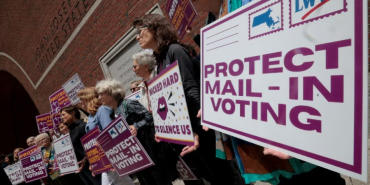 Supporters gather outside a federal courthouse in Boston, Massachusetts, during a legal challenge to President Donald Trump’s executive order tightening rules on mail-in voting.
