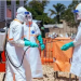 Healthcare workers in full personal protective equipment undergo disinfection at an Ebola treatment and response centre as health authorities intensify efforts to contain the outbreak in the Democratic Republic of the Congo and prevent further regional spread.