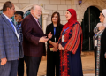 US ambassador to Israel Mike Huckabee is greeted by members of the local municipality as he arrives to visit the home of a Palestinian-American resident