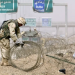 US troops clear rolls of razor wire from the main entrance to Fallujah, Iraq