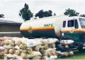 NDLEA operatives display the 20,000-litre fuel tanker and 165 bags of cannabis weighing 2,145kg after the illicit drugs are discovered in a concealed compartment of the vehicle in Ondo State.