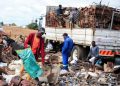 Scrap-metal dealers sorting metal scrap at a scrapyard