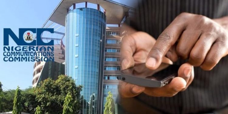 A person checking a mobile phone’s identification details as the NCC strengthens compliance checks for SIM-enabled devices in Nigeria.