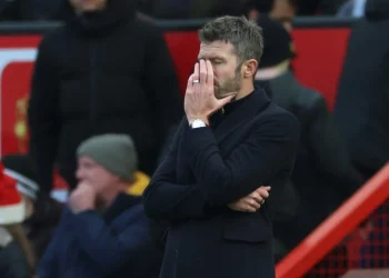Manchester United head coach Michael Carrick reacts during his side's 3-0 Premier League loss to Bournemouth at Old Trafford on Sunday.( photo credit: AFP)