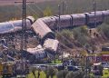 Derailed high-speed train carriages and emergency responders at the scene of a fatal collision near Urda, Toledo, Spain.