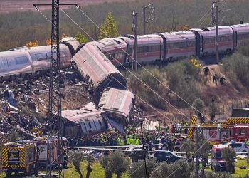 Derailed high-speed train carriages and emergency responders at the scene of a fatal collision near Urda, Toledo, Spain.