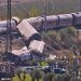 Derailed high-speed train carriages and emergency responders at the scene of a fatal collision near Urda, Toledo, Spain.