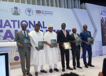 Minister of Finance and Coordinating Minister of the Economy Taiwo Oyedele and representatives of the Securities and Exchange Commission and UK International Development—holding copies of the newly launched roadmap.