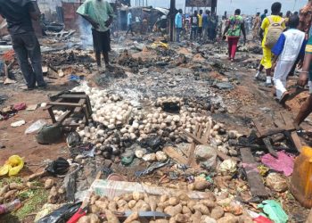 Burnt shops and charred debris at Oluku Market in Benin City, Edo State, following a fire triggered by a fuel tanker explosion.