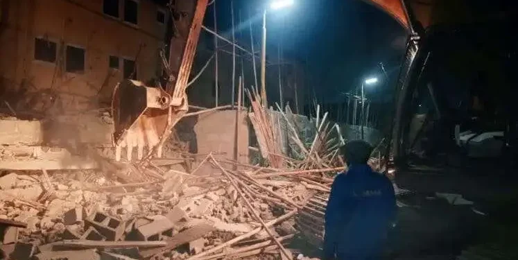 Emergency responders search through rubble following the collapse of a two-storey building under construction in Fadeyi, Lagos.