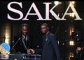 Nigerian singer Burna Boy presents the Sócrates Award to Arsenal and England forward Bukayo Saka at the 2026 Ballon d’Or ceremony in London.