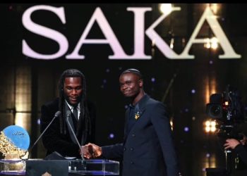 Nigerian singer Burna Boy presents the Sócrates Award to Arsenal and England forward Bukayo Saka at the 2026 Ballon d’Or ceremony in London.