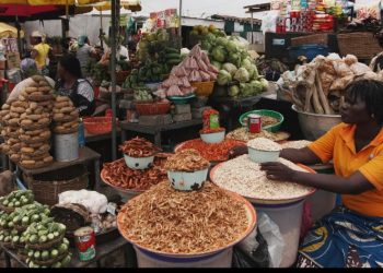 Traders selling tomatoes, bananas and other food items at a Nigerian market as the country’s inflation rate declines to 14.63 per cent in September 2026.