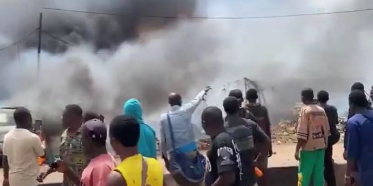 Scene of the fire that destroyed shops, vehicles and goods at Oluku Market in Benin City, Edo State.