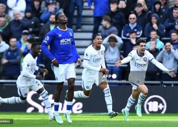 Chelsea forward Pedro Neto celebrates with his teammates on the pitch after scoring a goal.( Photo Credit AFP )