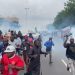 Police officers use tear gas to disperse protesters and other participants gathered at the Lekki Toll Gate for the sixth anniversary of the #EndSARS protests.