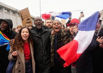 Tensions mount in France as thousands rally against Le Pen