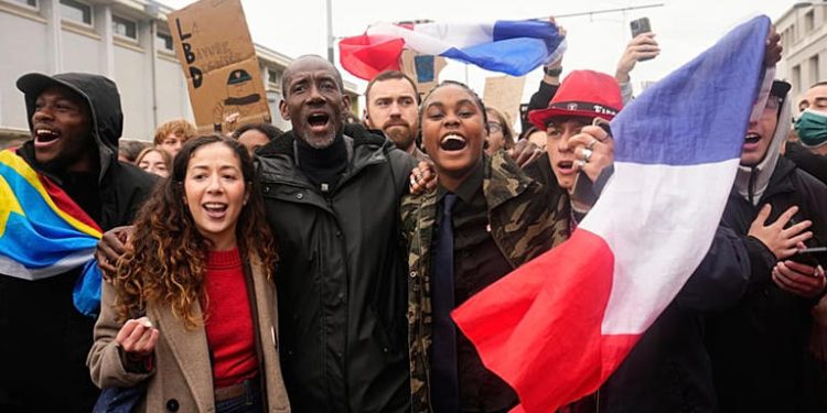 Tensions mount in France as thousands rally against Le Pen