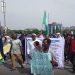 Retired Nigerian police officers hold a banner during a protest over the contributory pension scheme.