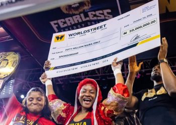 BBNaija ‘Level Up’ winner, Phyna, poses with her ₦50 million prize cheque after defeating actress Nkechi Blessing by a fourth-round technical knockout at Balmoral Promotions’ ‘Chaos in the Ring’ event in Lagos.