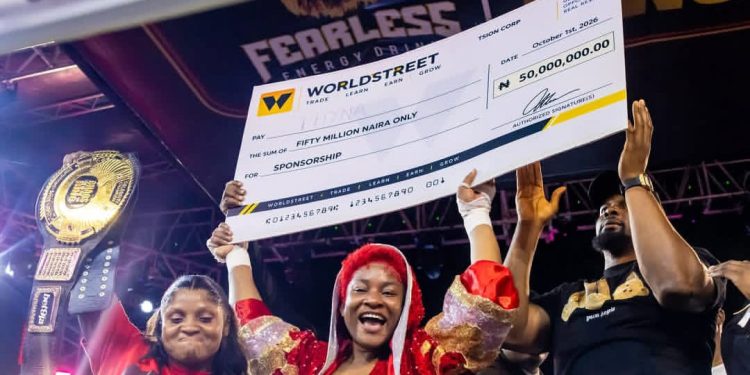 BBNaija ‘Level Up’ winner, Phyna, poses with her ₦50 million prize cheque after defeating actress Nkechi Blessing by a fourth-round technical knockout at Balmoral Promotions’ ‘Chaos in the Ring’ event in Lagos.