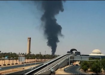 A plume of dark smoke rises behind the terminal at King Khalid International Airport in Riyadh, Saudi Arabia. A plume of dark smoke rises behind the terminal at King Khalid International Airport in Riyadh, Saudi Arabia.
